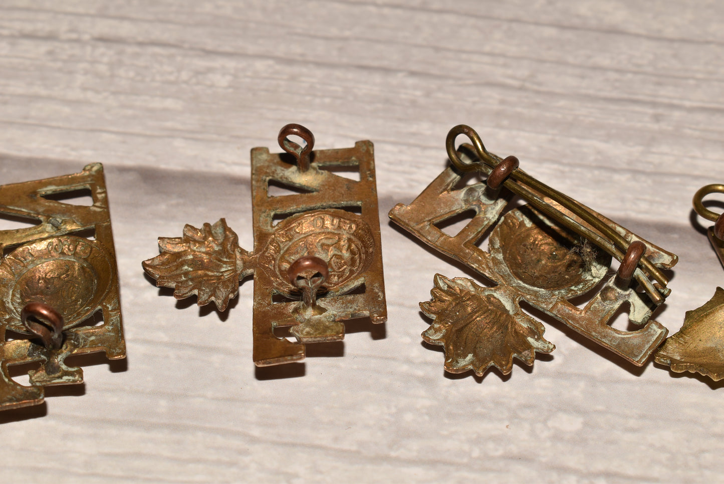 WW1 Northumberland Fusiliers Shoulder Title Badges - Original Brass Collection