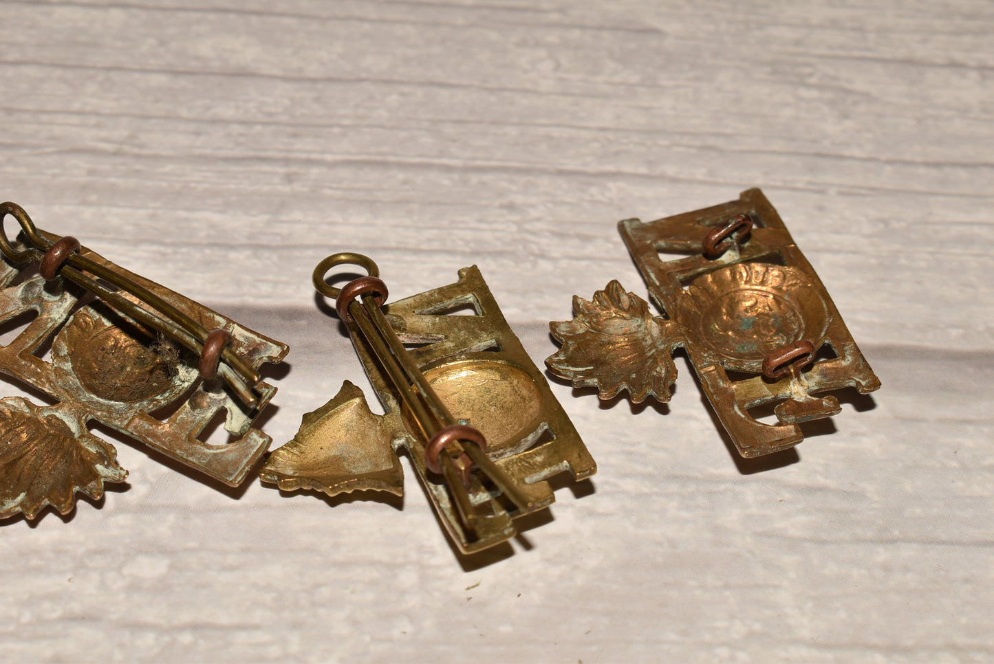 WW1 Northumberland Fusiliers Shoulder Title Badges - Original Brass Collection