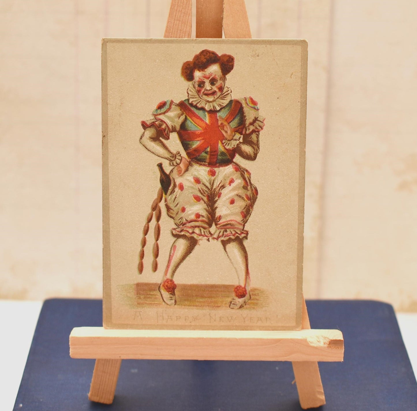 Antique Victorian New Year Card - Wonderful Macabre Scary Clown Stealing Drink and Sausages