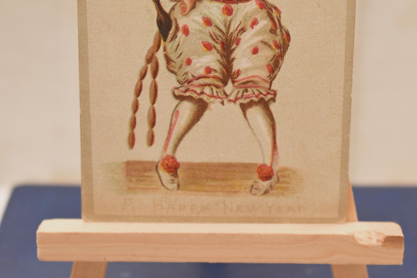 Antique Victorian New Year Card - Wonderful Macabre Scary Clown Stealing Drink and Sausages